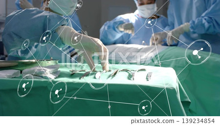Reaching gloved hand and grasping clamp from draped instrument tray at operating room, AR icons Reaching gloved hand and grasping clamp from draped instrument tray at operating room, AR icons 139234854