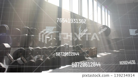 Black kettlebells sitting on rack in gym with panels, basket and data grid with floating codes Black kettlebells sitting on rack in gym with panels, basket and data grid with floating codes 139234914