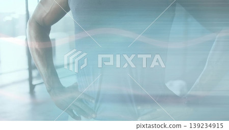 Showcasing muscular torso and arms inside fitness center, with gym top and window reflections Showcasing muscular torso and arms inside fitness center, with gym top and window reflections 139234915