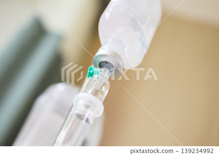 Close up medical intravenous IV drip in hospital background Close up medical intravenous IV drip in hospital background 139234992