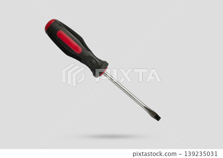 screwdriver fly over gray background close up screwdriver fly over gray background close up 139235031