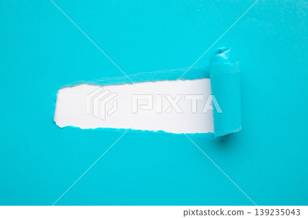 Blue torn paper rolled edge with space isolated on white background Blue torn paper rolled edge with space isolated on white background 139235043