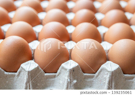 Fresh organic brown chicken eggs in cardboard tray 139235061