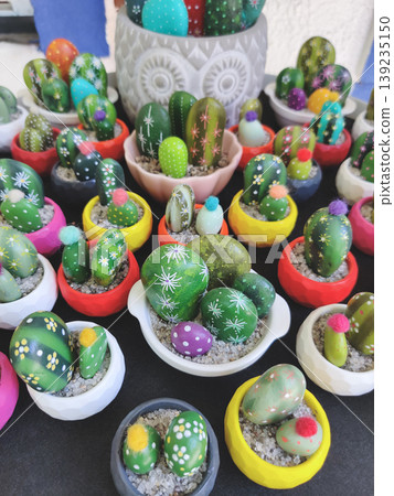 Hand-painted stone cacti in colorful miniature pots in Turkey Hand-painted stone cacti in colorful miniature pots in Turkey 139235150