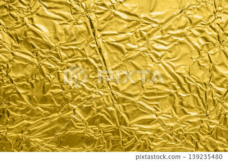 Luxury shiny metallic golden foil crumpled texture background Luxury shiny metallic golden foil crumpled texture background 139235480