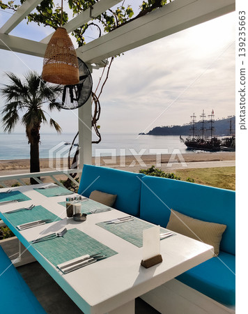 beautiful interior of a restaurant on the seashore beautiful interior of a restaurant on the seashore 139235663