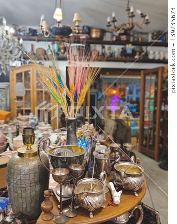 Antique shop interior with vintage silverware and decorative items in Turkey 139235673