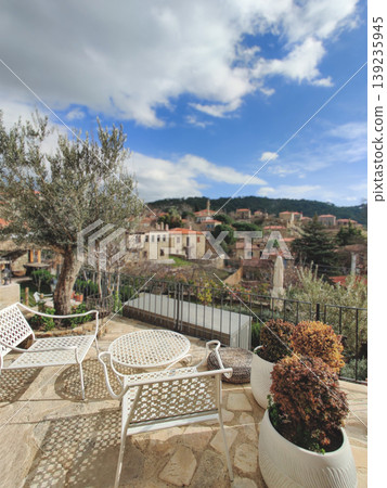 Boutique hotel terrace overlooking Adatepe village and mountains 139235945