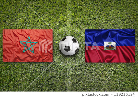 Morocco vs. Haiti flags on a soccer field Morocco vs. Haiti flags on a soccer field 139236154