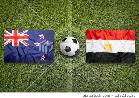 New Zealand vs. Egypt flags on a soccer field New Zealand vs. Egypt flags on a soccer field 139236155