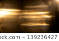 abstract horizontal golden lens flare anamorphic light leak blurred bokeh glowing streaks dark background representing cinematic overlay optical effect luxury elegant design 139236427