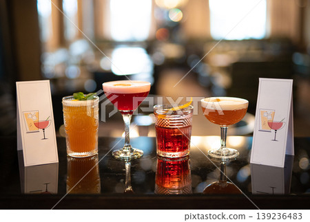 beautiful and delicious alcoholic cocktails prepared at the bar by the bartender. beautiful and delicious alcoholic cocktails prepared at the bar by the bartender. 139236483