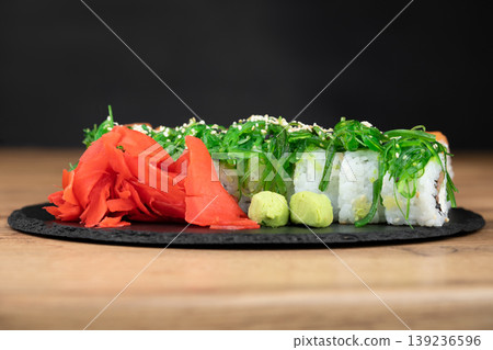 delicious traditional Japanese sushi and rolls on a plate 139236596
