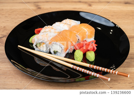 delicious traditional Japanese sushi and rolls on a plate 139236600