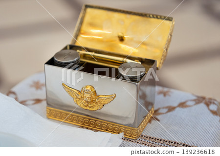 Silver and gold liturgical box with angel ornament 139236618