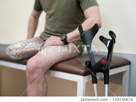 Ukrainian veteran preparing for prosthetic fitting in a rehabilitation center 139236674