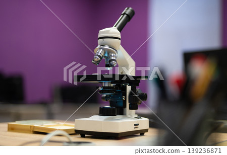 professional microscope in a school laboratory for the study of cells and bacteria professional microscope in a school laboratory for the study of cells and bacteria 139236871