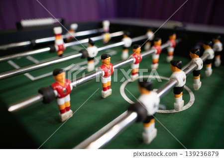 A close-up of the table football game of football figures on the field A close-up of the table football game of football figures on the field 139236879