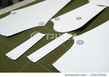 cutting of fabrics cut in production for sewing clothes cutting of fabrics cut in production for sewing clothes 139236886