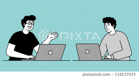 Two Young Professionals Collaborating on Laptops 139237035