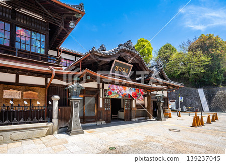 Exterior view of Dogo Onsen Main Building in Matsuyama City, Ehime Prefecture, a sunny tourist scene. 139237045
