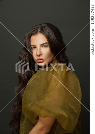 Gorgeous brunette woman with long healthy hair on dark background 139237458