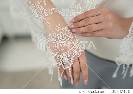 wedding veil close-up of embroidered pattern on hand 139237496