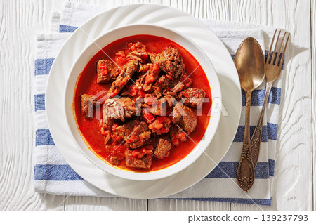 Hungarian beef goulash in a white bowl Hungarian beef goulash in a white bowl 139237793