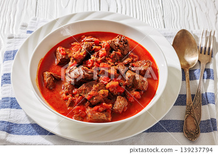 Hungarian beef goulash in a white bowl Hungarian beef goulash in a white bowl 139237794