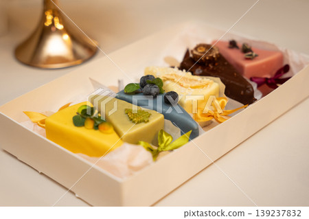 Assorted colorful triangle shaped cakes in a gift box Assorted colorful triangle shaped cakes in a gift box 139237832