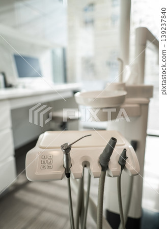 Modern dental treatment room with professional chair and equipment 139237840