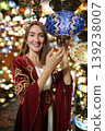 Young girl in Ottoman dress posing in traditional Turkish lamp shop in Turkey 139238007