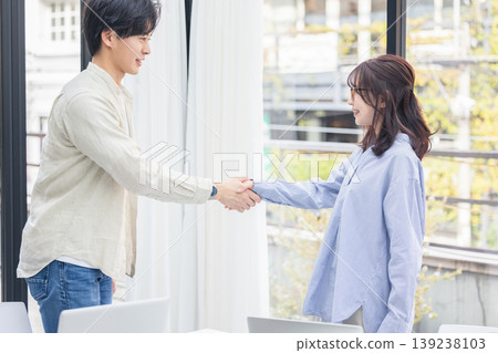 Two business people shaking hands Two business people shaking hands 139238103
