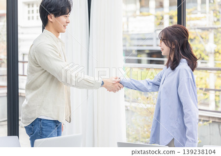 Two business people shaking hands Two business people shaking hands 139238104