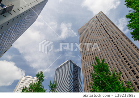 Landscape of the office town looking up at a skyscraper Landscape of the office town looking up at a skyscraper 139238682