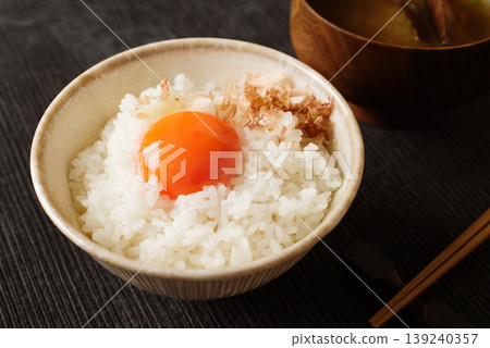 Close-up of rice with raw egg on top Close-up of rice with raw egg on top 139240357