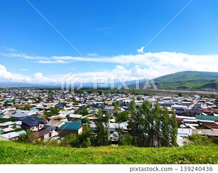 Mountain ranges and cityscapes in a plateau region 139240436