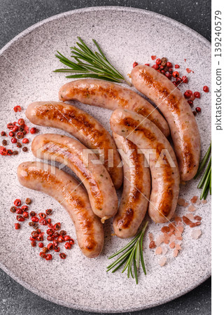 Grilled pork or chicken sausages, smoked fried food with salt and spices. Grilled sausages Grilled pork or chicken sausages, smoked fried food with salt and spices. Grilled sausages 139240579