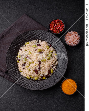 Asian food with rice, edamame, carrots, tofu, and spices. Rice with edamame Asian food with rice, edamame, carrots, tofu, and spices. Rice with edamame 139240591