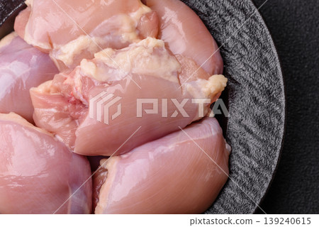 Raw chicken thigh fillet, boneless and skinless, for roasting. Raw thigh fillet Raw chicken thigh fillet, boneless and skinless, for roasting. Raw thigh fillet 139240615