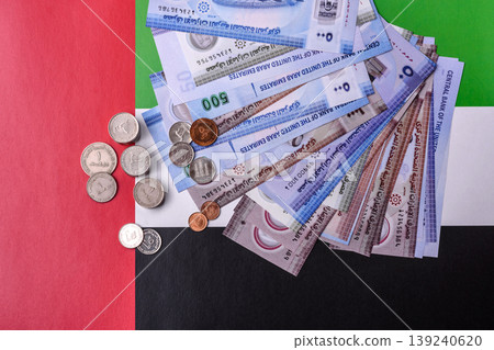United Arab Emirates cash, dirhams and coins for exchange and financial transactions. UAE currency United Arab Emirates cash, dirhams and coins for exchange and financial transactions. UAE currency 139240620