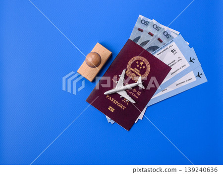China, Chinese passport with money and flight tickets. Chinese passport China, Chinese passport with money and flight tickets. Chinese passport 139240636