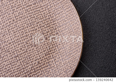 An empty ceramic round plate, kitchen utensils for a dinner table. An empty plate An empty ceramic round plate, kitchen utensils for a dinner table. An empty plate 139240642