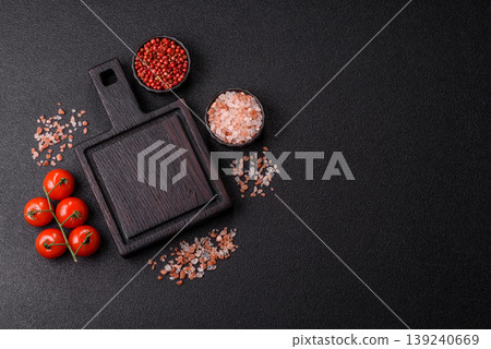 An empty wooden cutting board, kitchen utensils for food preparation. An empty cutting board An empty wooden cutting board, kitchen utensils for food preparation. An empty cutting board 139240669