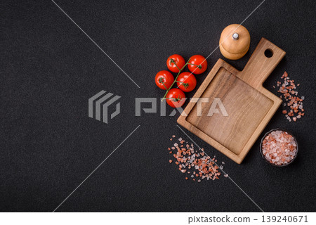 An empty wooden cutting board, kitchen utensils for food preparation. An empty cutting board An empty wooden cutting board, kitchen utensils for food preparation. An empty cutting board 139240671