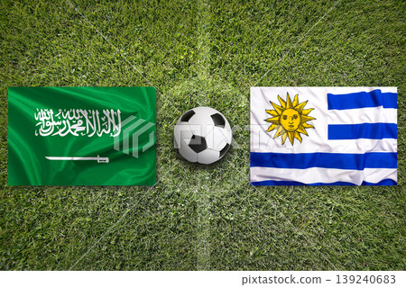 Saudi Arabia vs. Uruguay flags on a soccer field Saudi Arabia vs. Uruguay flags on a soccer field 139240683