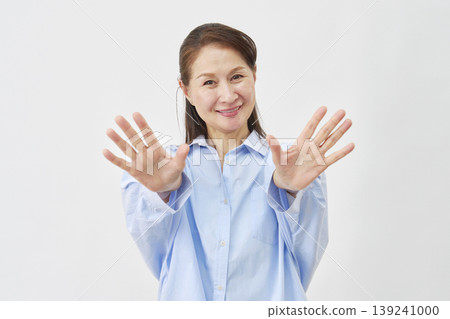 Elderly woman stopping on white background Elderly woman stopping on white background 139241000