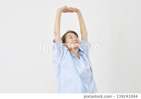 Elderly woman stretching on white background Elderly woman stretching on white background 139241004