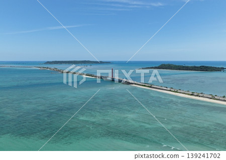 Drone footage (April) showing the emerald green sea and bridge overlooking the Kaichu Road in Okinawa Prefecture. 139241702