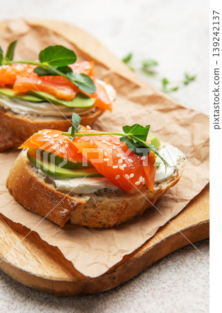 Salmon avocado toast with cream cheese and greens Salmon avocado toast with cream cheese and greens 139242137